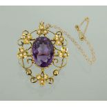 A 9ct gold and amethyst Victorian brooch / pendant, with safety chain, the large central oval