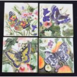 A set of four butterfly tiles.