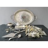 A quantity of silver plateware including a tray, cigarette box and flatware, bracelet, tea pot etc.