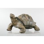 A carved model of a tortoise.