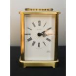 A brass carriage clock.