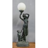 A bronze style lamp; woman and child raising orb shade.