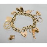 A 9ct gold charm bracelet with ten charms and heart form clasp and safety chain, London 1970. 62.