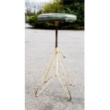 An adjustable workmans adjustable stool, octagonal shape, enamelled base.