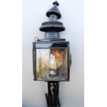 A 19th century brass carriage lamp, painted black.