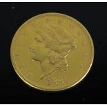 An 1883 USA 20 Dollars with double eagle, 900 (21ct gold) 33.43g, 34mm diameter.