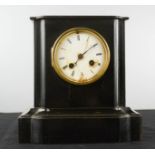 An ebonised mantle clock.