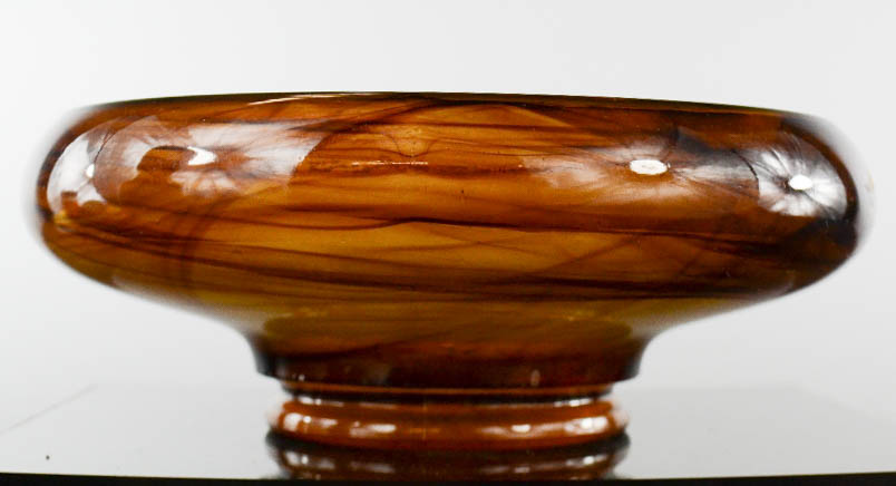 A vaseline glass bowl, smokey swirl pattern, 23cm diameter.