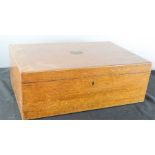 A 19th century mahogany box with brass shield plaque.