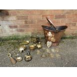 A copper coal scuttle with horse brasses, spoon, turtle etc.