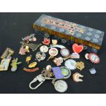 A group of collectable buttons and badges.