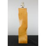 A modern carved treen table lamp base.