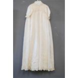 A Victorian silk and lace christening dress.