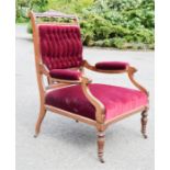 A 19th century mahogany armchair, with red velvet button back panel and seat, and fret carved