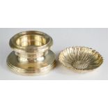 A silver pedestal trinket dish, together with a white metal dish in the form of a flower.