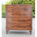 A Victorian mahogany bow front chest of two short over three long graduated drawers.