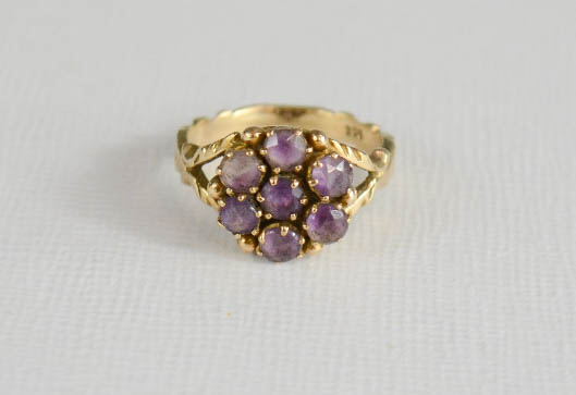 A yellow metal and amethyst cluster flower head ring. - Image 2 of 2