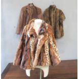 A Goldix imitation leather jacket and a faux fur jacket by the Jayley collection, and a fur