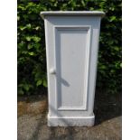 A white painted pine cupboard, with single panel door.
