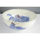 A Chinese blue and white bowl, depicting cockerel, hen and chick. 19cm high.