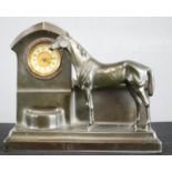 A Spelter mantle clock, with arabic dial in the form of a horse with trough.