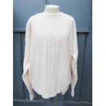 A pink Lord jumper, size 48, with 75% merino wool.