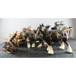 A group of ceramic shire horses and carts.