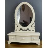 A white painted toilet mirror.