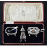 A silver cruet set, in the original blue glass liners and presentation box, Birmingham 1937, 4.