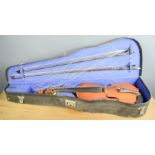 A Violin with two bows and a case.