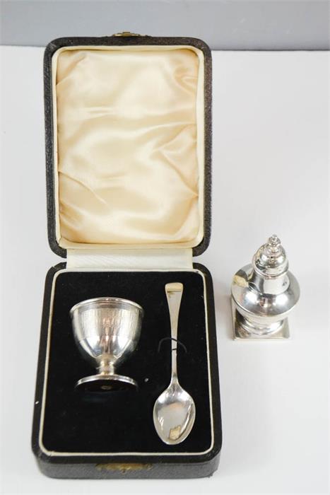 A silver Christening set; bakelite lined egg cup Birmingham, and spoon Sheffield 1919, together with