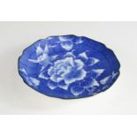 A blue and white Japanese dish depicting a peonie.