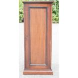 A mahogany cupboard, with sliding shelves.