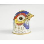 A champleve enamel thimble in the form of a birds head.