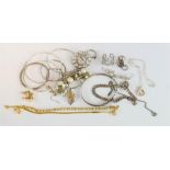 A group of silver bangles, earrings, bracelet with heart form charm, a horse pendant necklace etc.