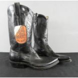 A pair of Dan Post Lizard cowboy boots in black.