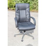 A leatherette office chair, with swivel chrome base.