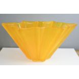 An Art Deco orange glass fruit bowl.