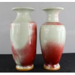 Two 20th century Chinese ox blood Sang de Boeuf type vases on grey ground, character mark to the
