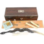 A rosewood box, mother of pearl inlay, with bone carved needle holder, pen knives, mother of pearl