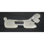 A 1930s Sabino frosted glass knife rest in the form of a poodle. 8cm long.