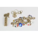 A silver charm bracelet and enamel charms, together with a silver ingot pendant necklace, and a