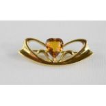 A Charles Horner Art Nouveau rolled gold brooch with citrine inset.