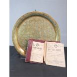 A brass tray, tin of pre-decimal coins and a group of ration books.