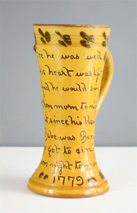 A twin handled slip glazed cup dated 1779, with inscription 'Ere He Was Wed, His Heart was Light, - Image 2 of 2