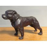 A bronze staffie dog, 21cm high.