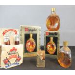 A group of whisky, four examples of Dimple bottles with contents and some original boxes.