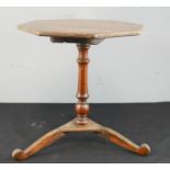 An apprentice piece tilt top table with octagonal top.