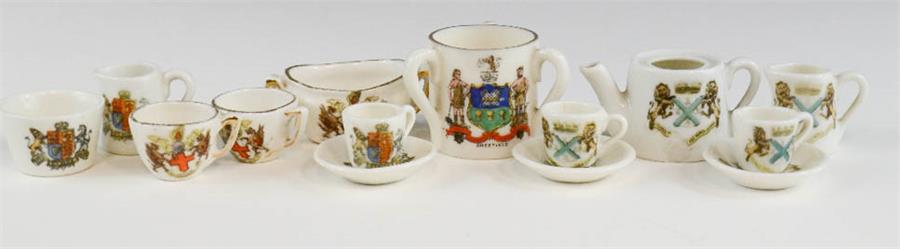 A group of miniature Crestware, including part tea services and Sheffield loving cup.