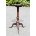An 18th century oak tripod table / wine table, with dished circular top, column base, 69cm high by
